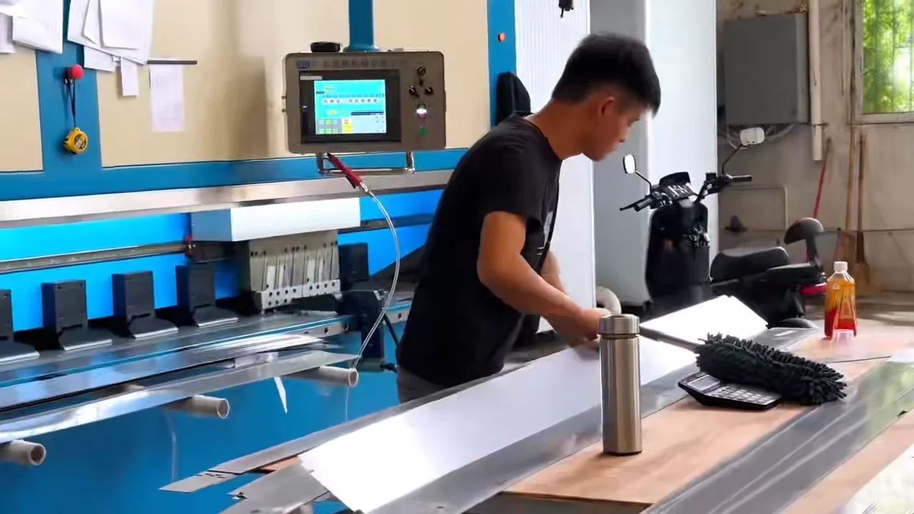 AIME workshop operator processing metal components